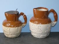 691 · 2 ANTIQUE POTTERY HARVEST JUGS