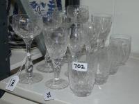 702 · GROUP OF 12 CRYSTAL GLASSES IN