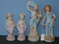 722 · GROUP OF 4 BISQUE FIGURINES (S