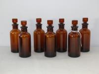 7 AMBER GLASS BOTTLES WITH STO
