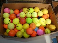 BOX OF COLOURED GOLF BALLS
