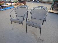 1963 · 2 BLACK METAL ARMCHAIRS