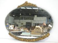 Oval Framed Wall Mirror With G