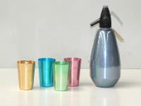 76 · CASED ANODIZED TUMBLER SET & A