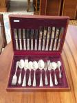 1095 · A CASED PLATED CUTLERY SERVICE